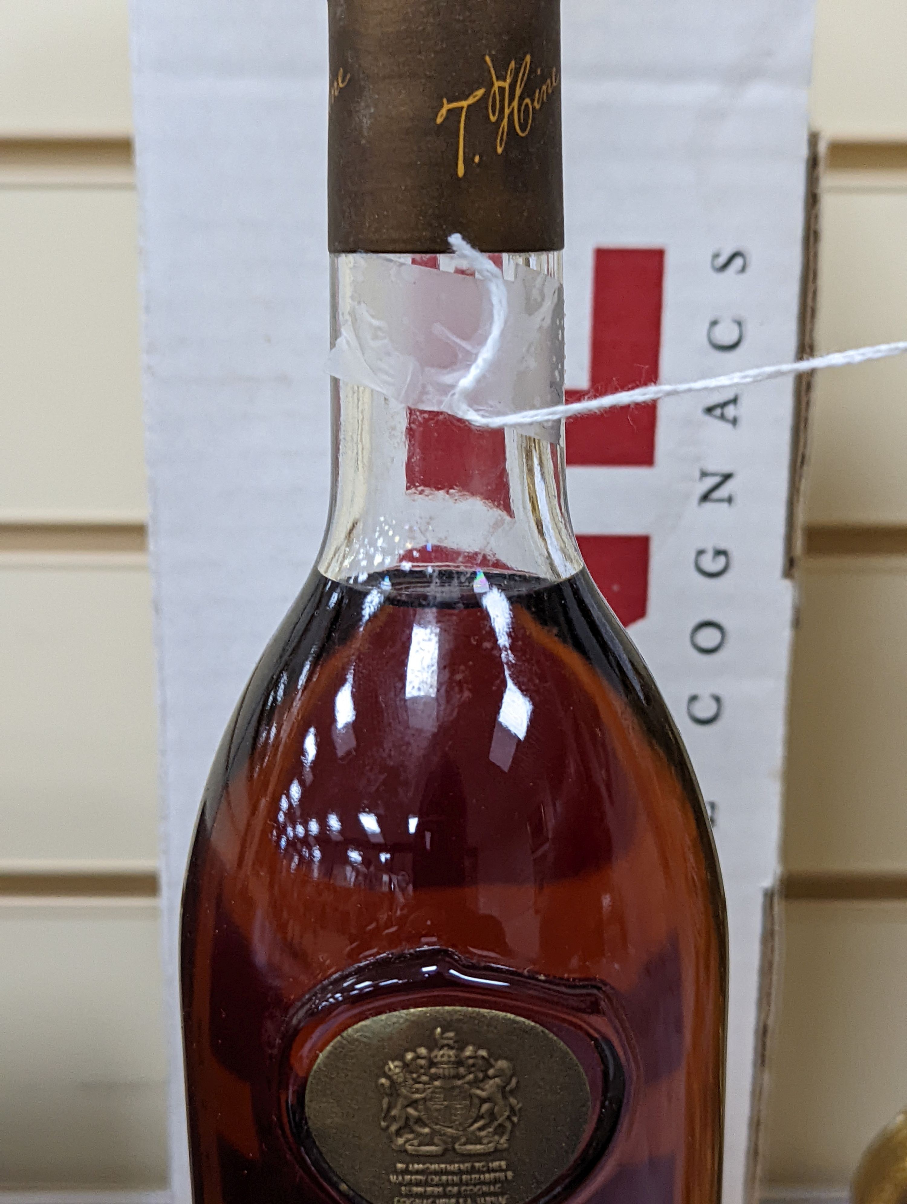 One bottle of Hine Grand Champagne Cognac, 1975. Original cardboard box.